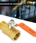 Built Like A Tank 3/4 Inch Brass Ball Valve Plumbing Shut Off High Flow Water Line Fitting Corrosion Resistant Heavy Duty Pipe Connector For Reliable Home Use with orange handle and threaded ends.