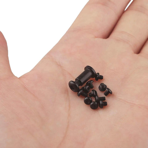 Knifemen Gonna Swear By This Badass 20 Piece Pocket Knife Upgrade Kit Featuring Deep Carry Clip And Omega Springs Compatible With Benchmade Bugout 535, showing black replacement screws in hand.