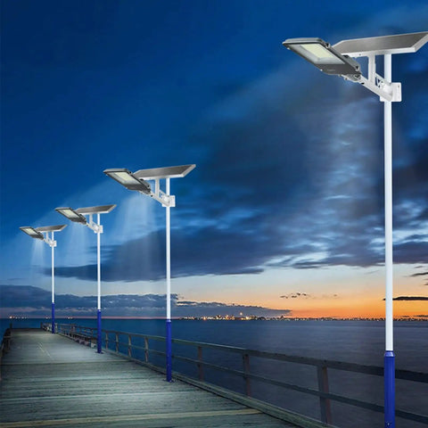 Hella Bright Solar Security Lights Outdoor With Reliable Motion Sensor Technology And IP65 Waterproof Build Perfect For Yard Garage Driveway Featuring 300W Equivalent Kickass Flood Lighting lighting up a wooden pier at dusk.
