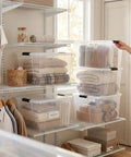 Organized closet with 60 Quart Clear Plastic Storage Bins With Secure Latching Lids, neatly stacked and filled with blankets.