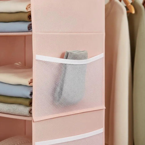 Upgrade Closet Game With This Heavy Duty Double Sided Hanging Wardrobe Organizer Packing Deep Side Pockets For Shoes And Gear To Instantly Boost Vertical Storage Capacity While Keeping Bedrooms Clean And Stress Free All Year. Image of deep side pockets holding a gray sock.