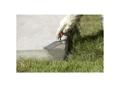 Applying Quick Set Cement And Mortar Mix In A Ten Pound Pail Bonds Concrete Brick And Block In Ten Minutes Flat with trowel.