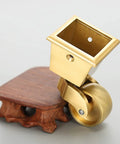 Heavy Duty Brass Caster Wheels For Furniture Slick Polished Gold Vintage Casters Roll Smooth As Silk With 360 Degree Swivel Rotation Rock Solid Square Cup Mount and Screws Included, detailed view of square cup mount.