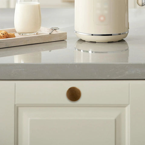 Set Of 10 Antique Brass Cabinet Knobs And Zinc Alloy Drawer Pulls For Kitchen Cabinets And Furniture, shown on white cabinet