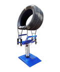 Solid Build Pneumatic Tire Changer And Tire Spreader For Compact Cars And Motorcycles Heavy Steel Construction tool with tire mounted.