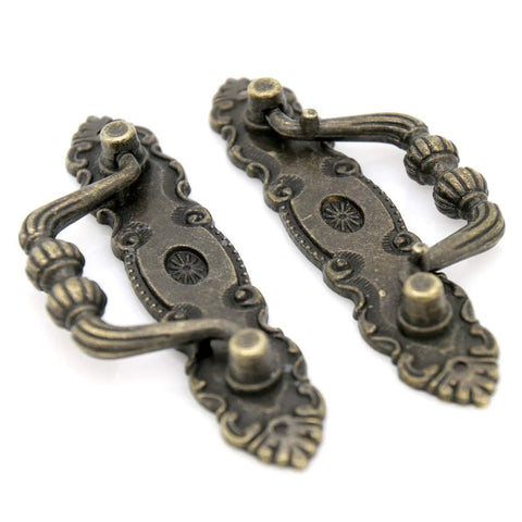 Two vintage antique brass bail pulls for drawers with distressed finish, part of Six Pack Vintage Antique Brass Bail Pulls For Drawers Cabinets Dressers Cupboards Set Featuring 4.1 Inch Length And 1.5 Inch Height Inter Hole Spacing 3.5 Inches Made From Zinc Alloy With Distressed Finish Retro Rustic Hardware set.
