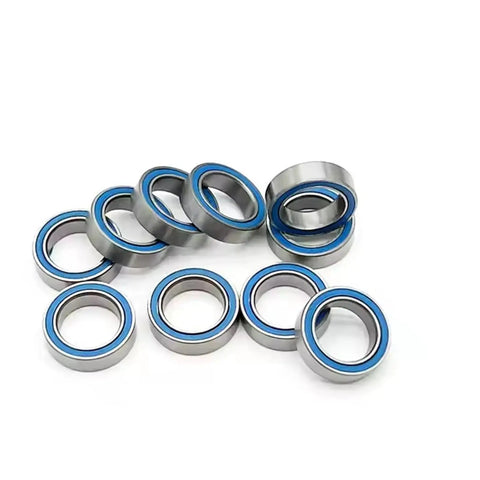 Top Shelf Blue Miniature Ball Bearings 6700 2RS Rubber Sealed RC Car Parts 10X15X4 MM Abec 7 Precision visible in a pile.