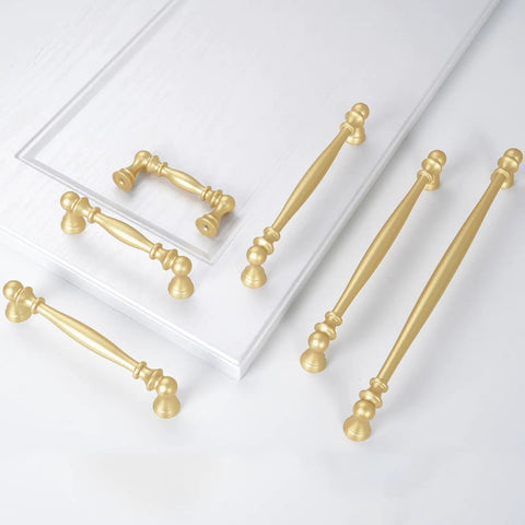 10 Pack 5 Inch Brushed Gold Cabinet Pulls Heavy Duty Zinc Alloy Drawer Handles For Kitchen Cupboards And Dressers laid out on a white surface.