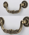 Straight Up Vintage Antique Bronze Drop Bail Pulls With Slick Carved Texture, showing floral design, 3.8 inch hole centers.