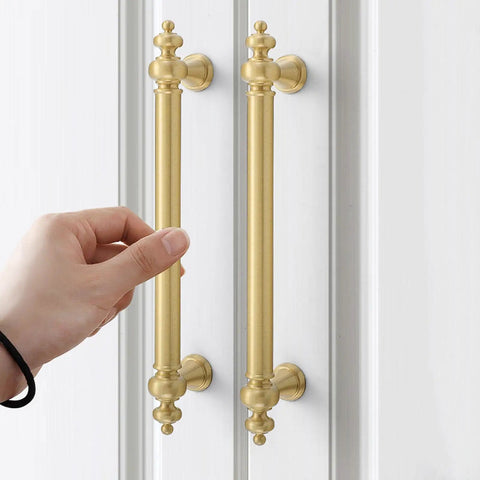 Next Level Gold Plated Brass Cabinet Pulls With Double Hole Handles Ideal For Drawers And Wardrobes Solid Brass Furniture Hardware that is being grasped.