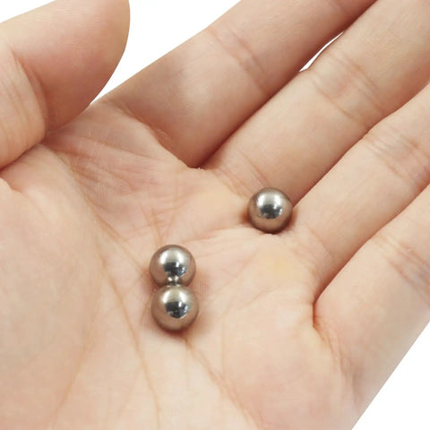 Premium 8Mm Hardened Bearing Steel Balls in hand, showcasing precision ground metal rolling components for repairs.