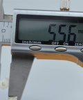 Measuring Real Deal White Nylon Hex Standoff 100 Pack M3x12mm with digital calipers showing 556 mm.
