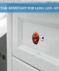Fresh Modern Cabinet Knobs 2 Pack With Smooth Surface And Dope Red Flower Design For Dressers Drawers And Cupboards showing round knob on white cabinet.