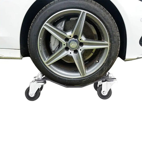 Whopping 6000 Lb Capacity Car Wheel Dollies Set Of 4 Heavy Duty Steel With Locking Brakes under a car tire on 3 inch swivel casters.