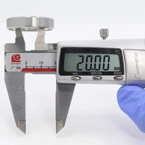 Digital caliper measuring 20.00mm of Built Tough Top Tier 440C Stainless Steel Deep Groove Ball Bearing S6804-2RS.