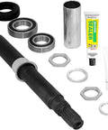 Heavy Hitter Washer Tub Shaft Rebuild Kit With Slick Bearings Precision Seals And Silicone Sealant For Dead Simple Installation showing parts including a steel shaft, bearings, and sealant.
