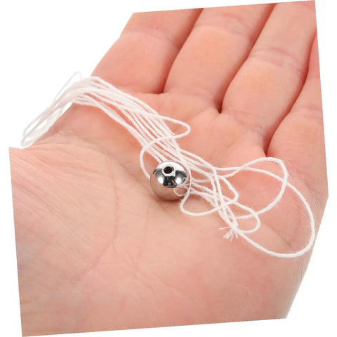 Hands On Pendulum Ball Physics Tool For Classroom And Lab in a hand showing metal design with string for mechanics education kit