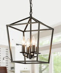 Four Light Black Farmhouse Chandelier With Industrial Metal Cage Adjustable Height Rustic Hanging Light With E12 Base in kitchen
