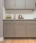 Kitchen cabinets with Solid Five Inch Square Cabinet Handles 10 Pack Brushed Brass Drawer Pulls for Kitchen Cabinets Hardware installed.