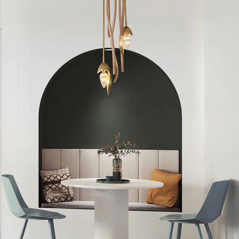 Premium Three Light Pendant Ceiling Lamp Solid Wood Design above a round table in a cozy dining nook, featuring soft LED glow.