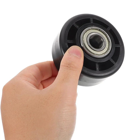 Universal Replacement Wheel Bearing Rollers For Treadmills And Exercise Bikes Heavy Duty Glide Casters held in hand close-up.