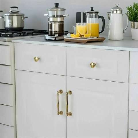 Antique Brass Cabinet Pulls 10 Pack Solid Brass Drawer Handles With Gold Plated Copper Retro Style Kitchen And Bathroom Hardware installed on modern white kitchen drawers.