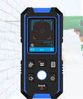 Precision Wall Scanner And Metal Detector Stud Finder with LCD display shows measurements against a brick wall.