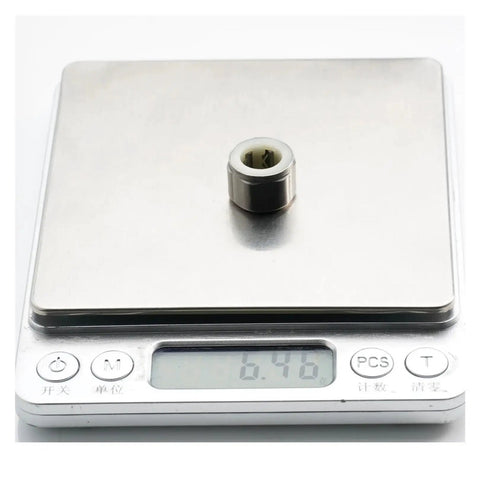 Heavy Duty One Way Clutch Needle Roller Bearing Set Built Tough For Zero Slop Operation on a digital scale showing weight.