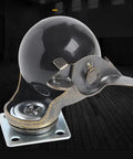 Rock Solid Swivel Castor Wheels With Secure Brake Vintage Bronze Polyurethane Rubber Rollers Super Quiet Glide Heavy Duty Furniture Replacement Casters Set Of Four Pieces close-up of a single caster wheel with a black spherical rubber roller and a sturdy metallic base.
