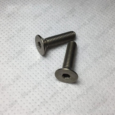 Built Different Titanium Gr2 Hex Socket Countersunk Flat Head Screws With No Slack Metric Fine Threads For Aerospace And Medical Rigs, M6 X 45Mm Pack Of Fifty Heavy Duty Fasteners, two screws on white background.