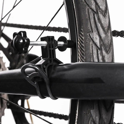 Close-up of Portable Bike Wheel Truing Stand For Front And Rear Rims Rim Adjustment Tool Lightweight Compact with black mount