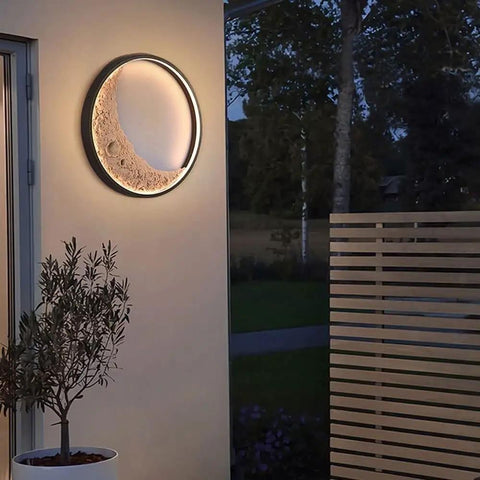 Heavy Duty Moon Wall Lantern Super Waterproof Exterior Porch Light With Warm Led Glow Resin Metal Construction For Villa Patio Backyard Vibes And Chill Atmosphere mounted on a wall with a plant nearby.