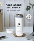 Portable Travel Electric Kettle With Tea Infuser, Mini 4 Temperature Settings, white, on desk next to laptop lid and box.