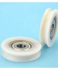 10 Pack U Groove Nylon Pulley Wheels Featuring Plastic Coated Bearings With A 12mm Bore And 60mm Diameter on blue background.