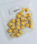 Awesome 45 Piece 6Mm Trimmer Capacitor Kit Featuring Nine Separate Values For Quick Radio Circuit Adjustments And Totally Hassle Free Weekend DIY Repair containing yellow 40pf capacitors in a plastic bag.