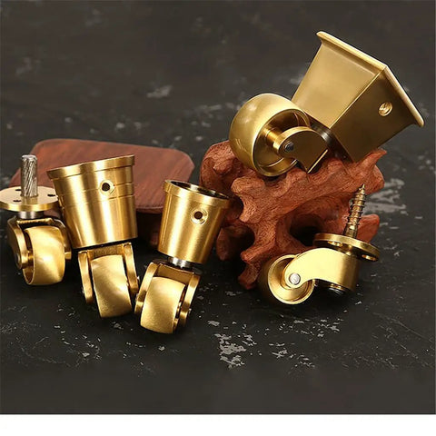 Four Piece Solid Brass Universal Caster Wheels displaying diverse designs for furniture, heavy duty support and smooth movement.