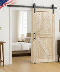 Top Shelf 50 X 96 Unfinished Barn Door Carved From Solid Spruce with sliding hardware, installed in a rustic room.