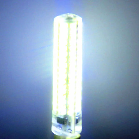 Close-up of a glowing LED bulb against a dark background, showcasing its bright light and cylindrical shape.