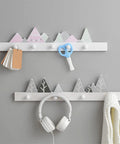 Solid Wooden Wall Mounted Coat Rack With Key Holder Smooth Black Finish Multi Purpose Entryway Organizer For Coats Hats Towels No Sweat Setup Straight Up Top Shelf Storage with decorative mountain design.