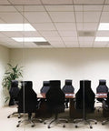 Conference room with ceiling light using EI500 M12 Contractor Select 500 Lumen Emergency Ballast For Fluorescent Fixtures, compact, black.