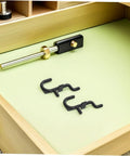 Ultimate Pegboard Hooks Set For Garage Wall Organization, Movable Layout To Fit Hand Tools And Small Gear, Universal Tool Hangers For Home And Shop, Flexible Pegboard Rack System For Kitchen Studio And Retail Displays black plastic hooks on drawer surface