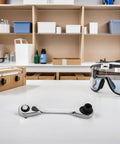 Real Deal Mini Double Ended Socket Ratchet Wrench With A Sweet Quick Direction Flip For Cranking Hex Fasteners In Those Awkward Tight Squeezes Around The Garage Shed on a workbench.