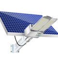 Built Like A Tank Solar Street Lights With Remote Control And IP65 Waterproof Design For Outdoor Yards Pathways And Driveways Featuring Dusk To Dawn LED Lighting That Truly Hits Different mounted on a wall with solar panel.