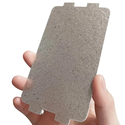 Hand holding a mica sheet, part of Five Pack Waveguide Covers For Microwave Ovens Mica Sheet Replacement Part Universal Microwave Repair Shield Helps Protect Magnetron From Splashes Ideal For Home Kitchen Office And Restaurant Use Two And A Quarter Inch By Four And Five Eighths Inch