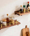 Rock Solid Eight Piece Brass Gallery Rails Kit featuring heavy duty metal spindle connectors on wooden shelves with spices.