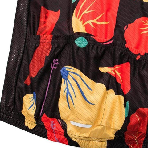 Colorful floral pattern on a dark fabric with yellow, red, and blue designs
