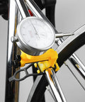 Beast Pro Grade Bike Wheel Truing Stand with Precision Percentage Table in use on a bike wheel, featuring spoke adjustment tool.