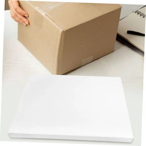 High Density Polyurethane Foam Sheets Heavy Duty White Cushioning Pads Custom Trim To Fit placed beside a cardboard box.