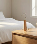 Heavy Duty Solid Wood Storage Hanger With Multiple Hooks on a bedside table in a bedroom, neat and compact for organizing accessories.