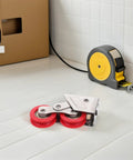 Rock Solid Stainless Steel Sliding Door Track Pulley With Heavy Duty Double Roller Wheels on white surface with tape measure